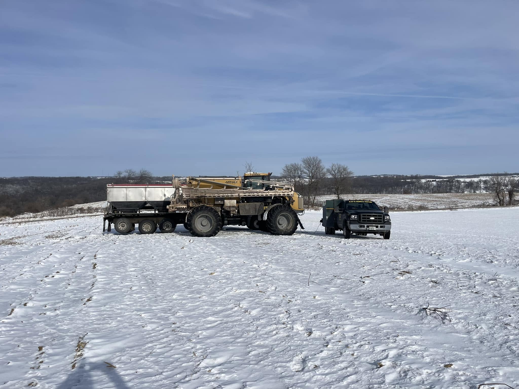 Ray's Mobile Repair working on equipment in a snowy field in Southern Wisconsin
